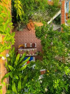 an overhead view of a garden with benches and trees at Terralia Villa in La Gi