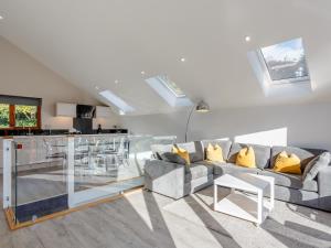 a living room with a couch and a kitchen at Waterside Lodge Three - Uk33350 in Southowram