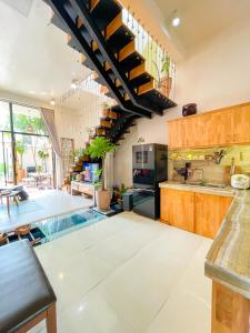 a kitchen with a swimming pool in the middle at Terralia Villa in Lagi