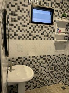 a bathroom with a sink and a window at Anwa house bangtao close to Mma Muaythai and beach in Ban Lum Fuang