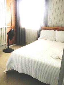 Una cama o camas en una habitación de Comoda casa en segunda planta