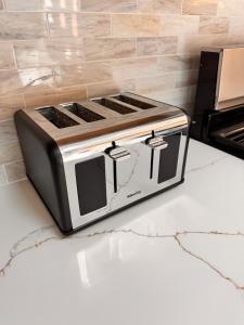a toaster oven sitting on top of a counter at Newly Renovated Brand New, Pristine 3Bedroom House in Christiansted
