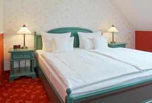Postel nebo postele na pokoji v ubytování Hotel Godewind