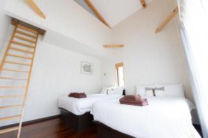 Ένα ή περισσότερα κρεβάτια σε δωμάτιο στο Hanare AOZORA