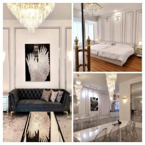 ケパラ・バタスにあるExecutive White Houzeのソファとシャンデリアのあるリビングルーム