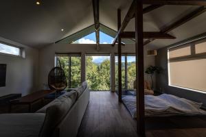 Postel nebo postele na pokoji v ubytování Hakuba Villa Kasumi