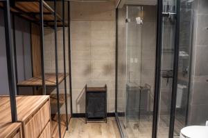 a bathroom with a shower and a glass shower stall at LOFT Apartment Downtown Area in Tijuana +13 photos
