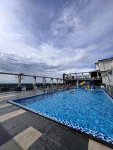 a large swimming pool on a cruise ship at WANida Suite At Al Waqaf Resident Bandar Baru Tunjung in Kota Bharu
