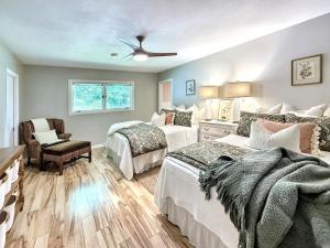 a bedroom with two beds and a ceiling fan at The Bodhi in Highlands