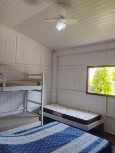 Postel nebo postele na pokoji v ubytování Rancho cachoeira