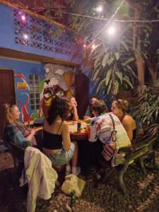 a group of women sitting at a table in a restaurant at Happy House Backpackers in Pai
