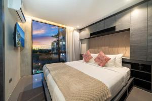 Ένα ή περισσότερα κρεβάτια σε δωμάτιο στο 5 Stars Facilities Condo Kamala Beach +40 φωτογραφίες