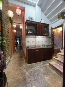 a kitchen with a sink and a counter top at Bamboo Homestay Old Quarter in Hanoi