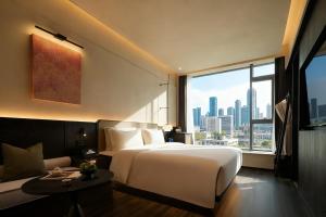 Katil atau katil-katil dalam bilik di Yomanjo International Hotel -Guangzhou Tower Zhujiang NewTown Sports West Road Branch &地铁站- Canton Fair Exclusive Rate