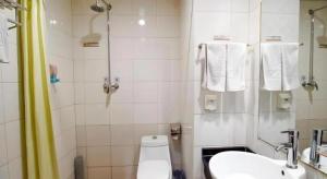 a bathroom with a toilet and a sink and a shower at Super 8 Hotel Xian Nanshaomen in Xi'an +52 photos
