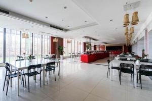 a large room with tables and chairs in a building at Sichuan Tennis International Hotel Main Building in Chengdu