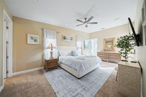 a bedroom with a bed and a ceiling fan at Chill-Inn, an Indian Wells Oasis in Indian Wells +55 photos