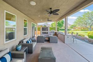 an outdoor patio with furniture and a ceiling fan at Chill-Inn, an Indian Wells Oasis in Indian Wells