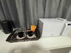 Kuchyň nebo kuchyňský kout v ubytování Loft 305B com Ar Condicionado no Bairro Muquiçaba, bem localizado para negócios e fácil acesso para todas as praias e montanhas da cidade - COM vaga de garagem