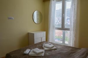 Posteľ alebo postele v izbe v ubytovaní Nautika Apartment