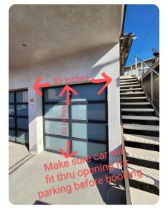 a sign on the side of a building with arrows on it at Feel At Home At A One Bedroom Apt 1 Block From The Beach in Hermosa Beach