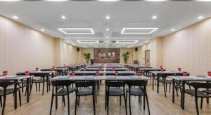 a large room with tables and chairs in it at Han Hotel Meisu Xi'an Longshouyuan Shenglong Plaza in Xi'an