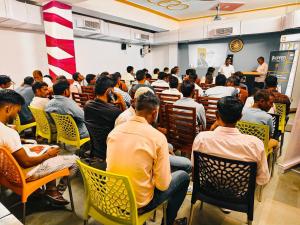 a large group of people sitting in a room at Elite Stay Hotel and Resort in Bāwal