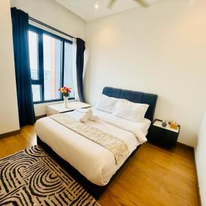 Ένα ή περισσότερα κρεβάτια σε δωμάτιο στο Lucentia Residence Bukit Bintang By Panorama