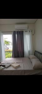 En eller flere senge i et værelse på Style Residences UNIT 130 A