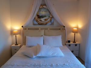 A bed or beds in a room at Melograno Apartments and Studios