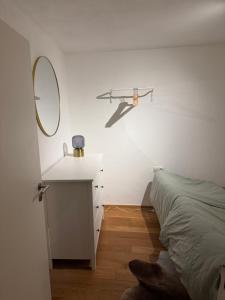 a bedroom with a bed and a mirror on the wall at Schlossblick in Sulzbach-Rosenberg