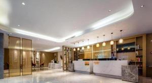 a lobby of a hotel with a bar in it at VX Hotel Wuhan Optics Valley Yangjia Bay Metro Station in Wuhan