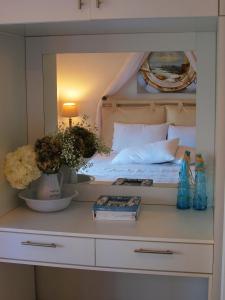 A bed or beds in a room at Melograno Apartments and Studios
