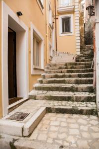 a set of stone stairs in front of a building at Altavilla in Gaeta