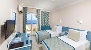 A television and/or entertainment centre at Galaxy Beach Hotel Alanya