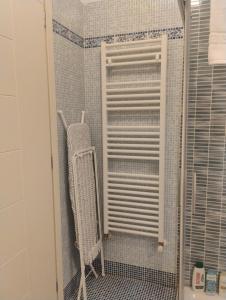 a bathroom with a white heater in a shower at Careggi apartment in Florence +17 photos
