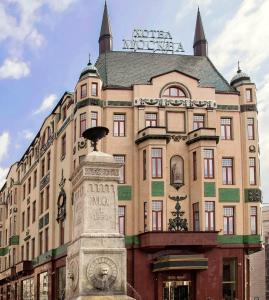 
a building with a clock on the front of it at Hotel Moskva in Belgrade
