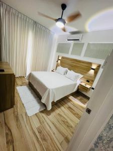 a bedroom with a bed and a ceiling at Bayahibe in Bayahibe