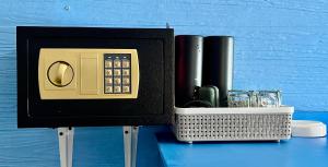 a black box with a calculator and a container on a table at Starlight Beach Resort in Ko Phayam