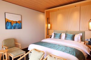 Ένα ή περισσότερα κρεβάτια σε δωμάτιο στο Tsuru Yoshikawa Onsen