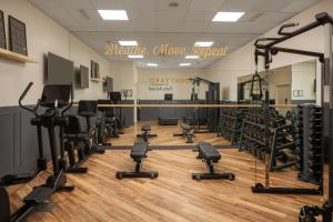 a gym with treadmills and exercise equipment at Courtyard by Marriott Paris Arcueil in Arcueil