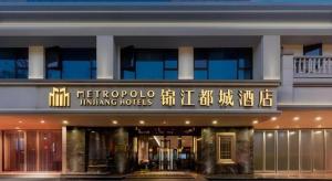 a hotel with a sign on the front of it at Jinjiang Metropolo Hotel Nanjing Confucius Temple Branch in Nanjing