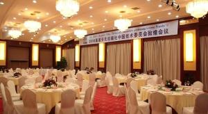 a banquet hall with white tables and white chairs at Dunhuang Grand Soluxe Hotel in Dunhuang +193 photos