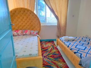 Ένα ή περισσότερα κρεβάτια σε δωμάτιο στο Beach Apartment