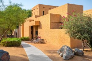 a bike parked in front of a building at The Ritz-Carlton Ras Al Khaimah, Al Wadi Desert in Ras al Khaimah