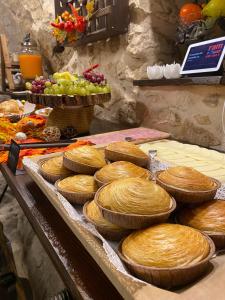 a bunch of pies sitting on a table at Il Vicoletto in Artena