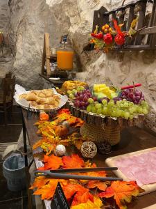 a table filled with fruits and vegetables on top at Il Vicoletto in Artena