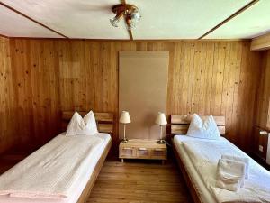 Ένα ή περισσότερα κρεβάτια σε δωμάτιο στο Scenic Stay Grindelwald Interlaken & Lauterbrunen