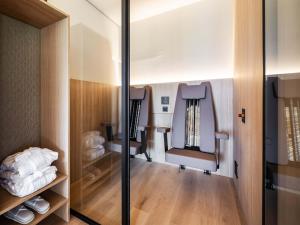 a room with two chairs on an airplane at Schloss & Boutique Hotel Mitterhart in Schwaz