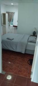 Postel nebo postele na pokoji v ubytování Greenery House